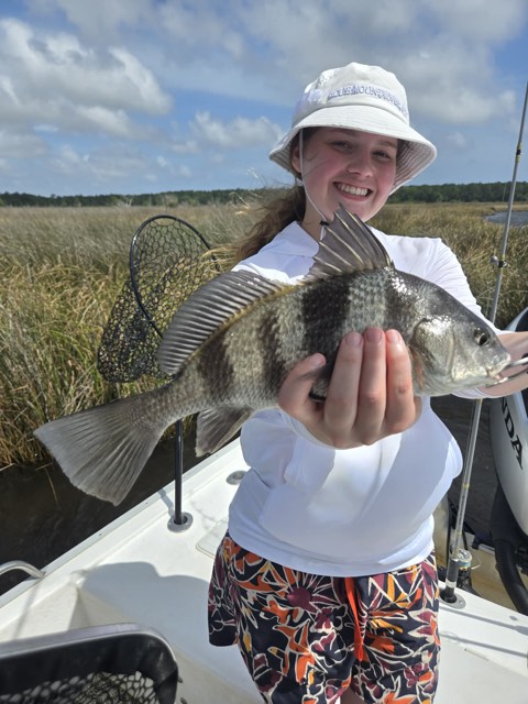 Guest displaying a fresh catch from Choctawhatchee Bay